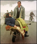 woman in wheelbarrow